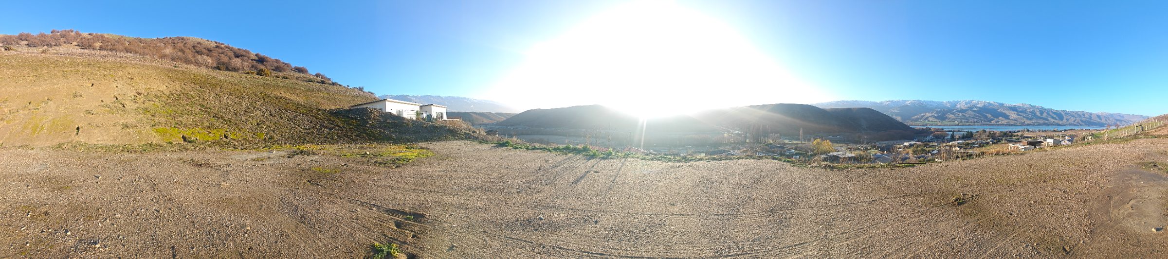 Panoramic view from Lot 18, the Vineyard Vista, sweeping across the section to the sun, the valley, and Lake Dunstan